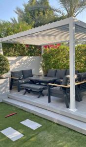 Aluminium pergola with sofa set